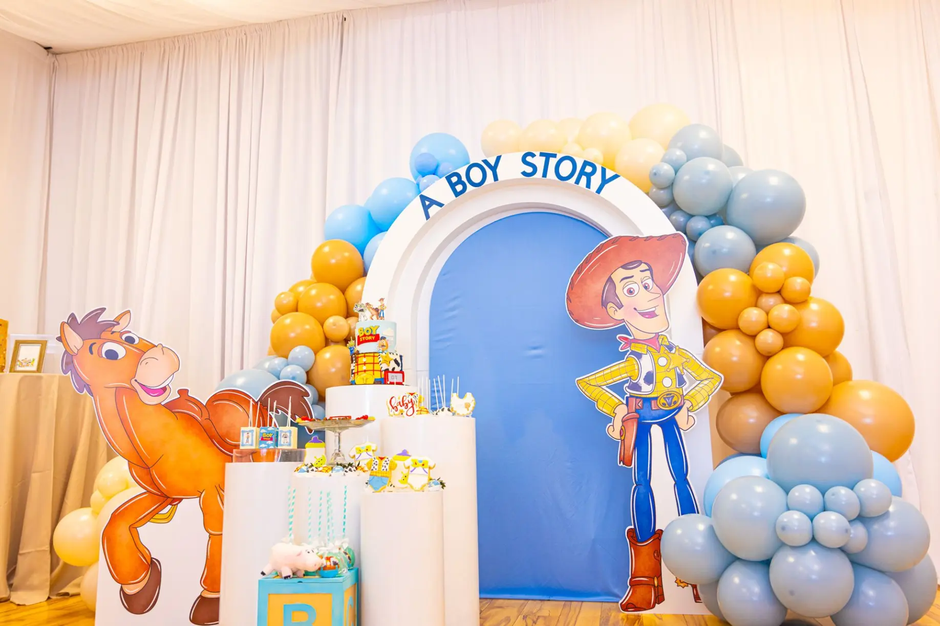 Its a boy balloon display with pastel blue and gold details at Unique Touch Events.