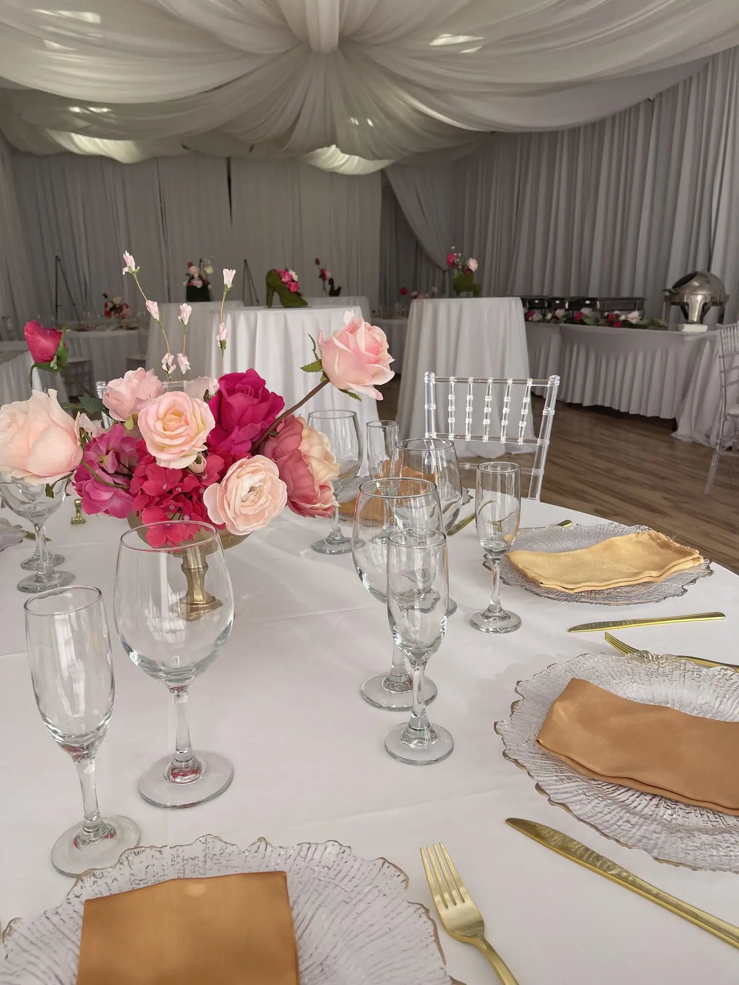 Celebration of life event with white floral décor and peaceful atmosphere.