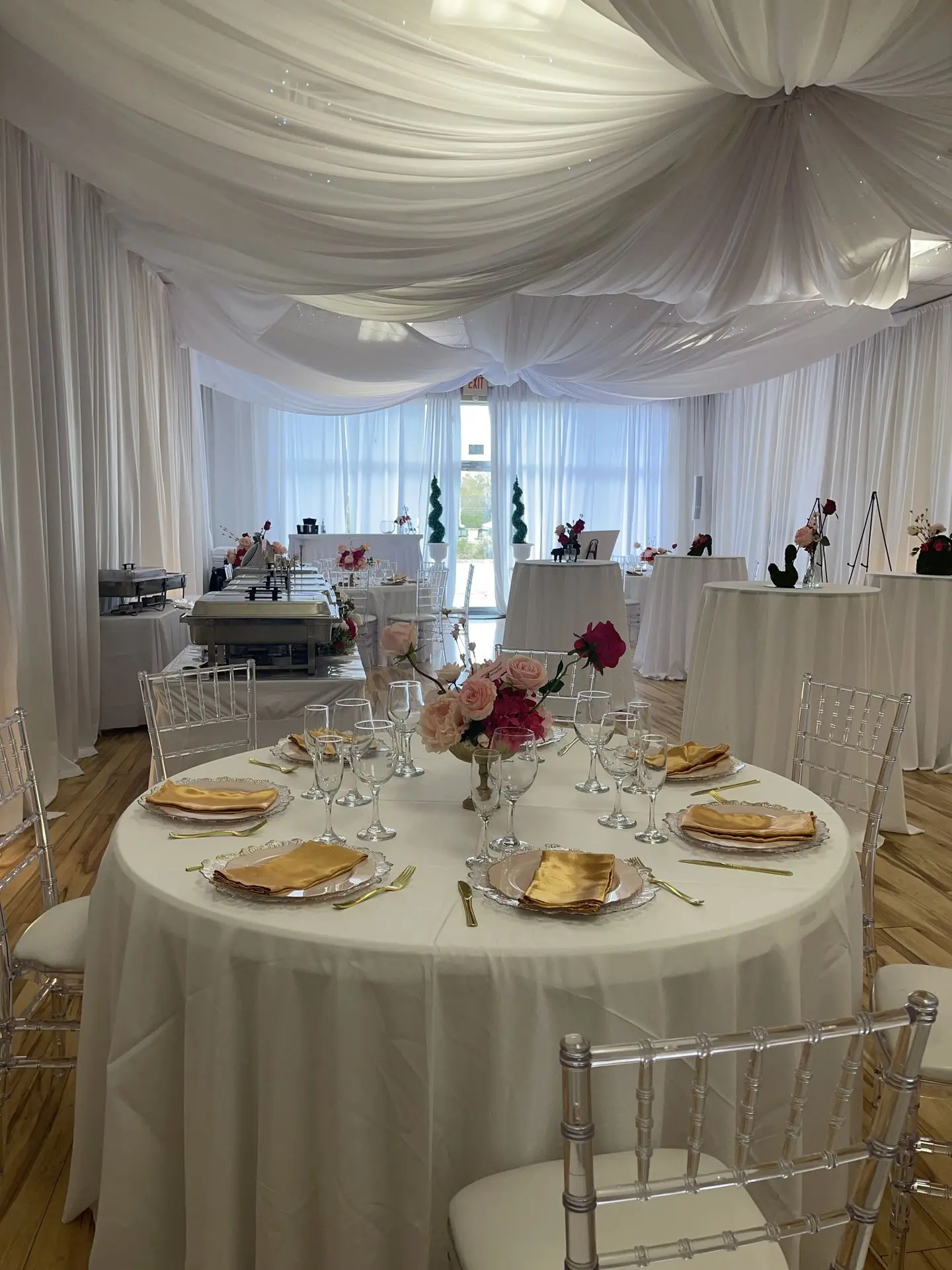 Celebration of life event with white floral décor and peaceful atmosphere.