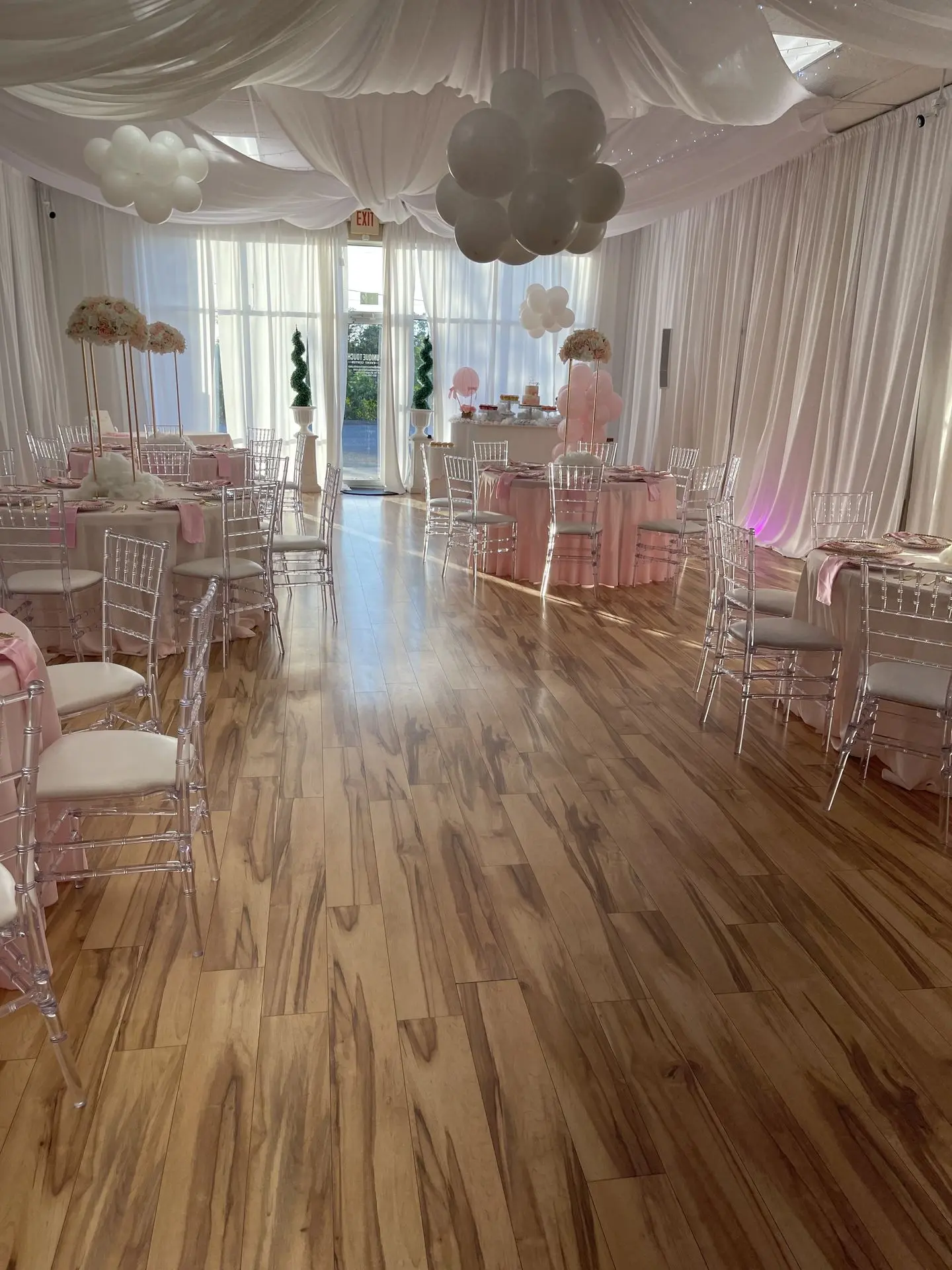 A wide-angle shot of your Orlando event space, showing tables, chairs, lighting, and décor in a finished setup.