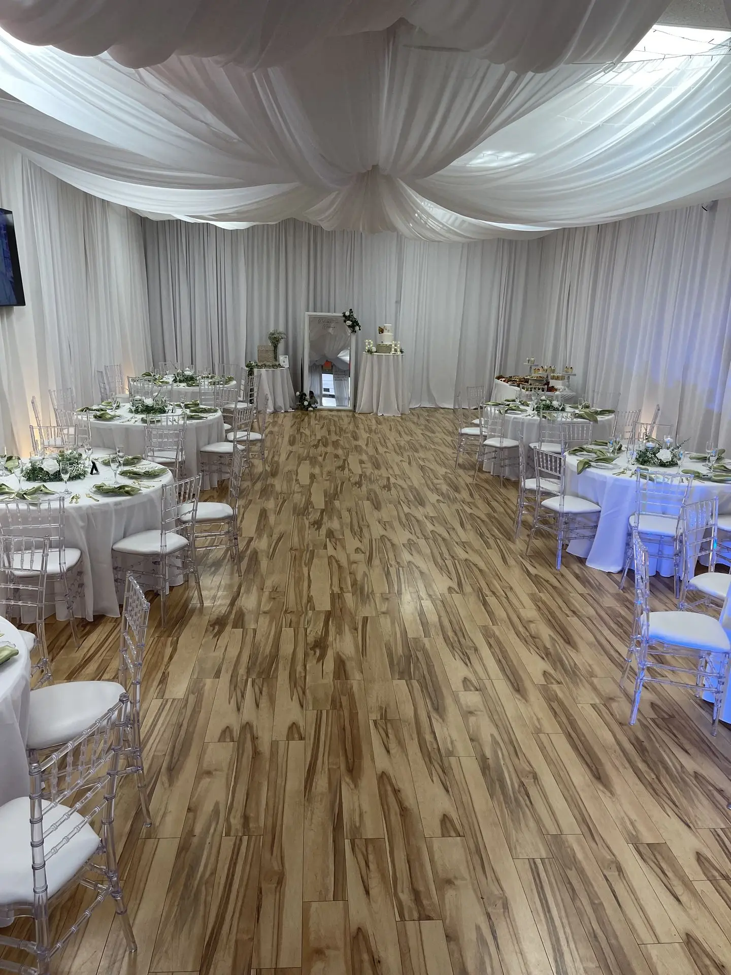 A wide-angle shot of your Orlando event space, showing tables, chairs, lighting, and décor in a finished setup.