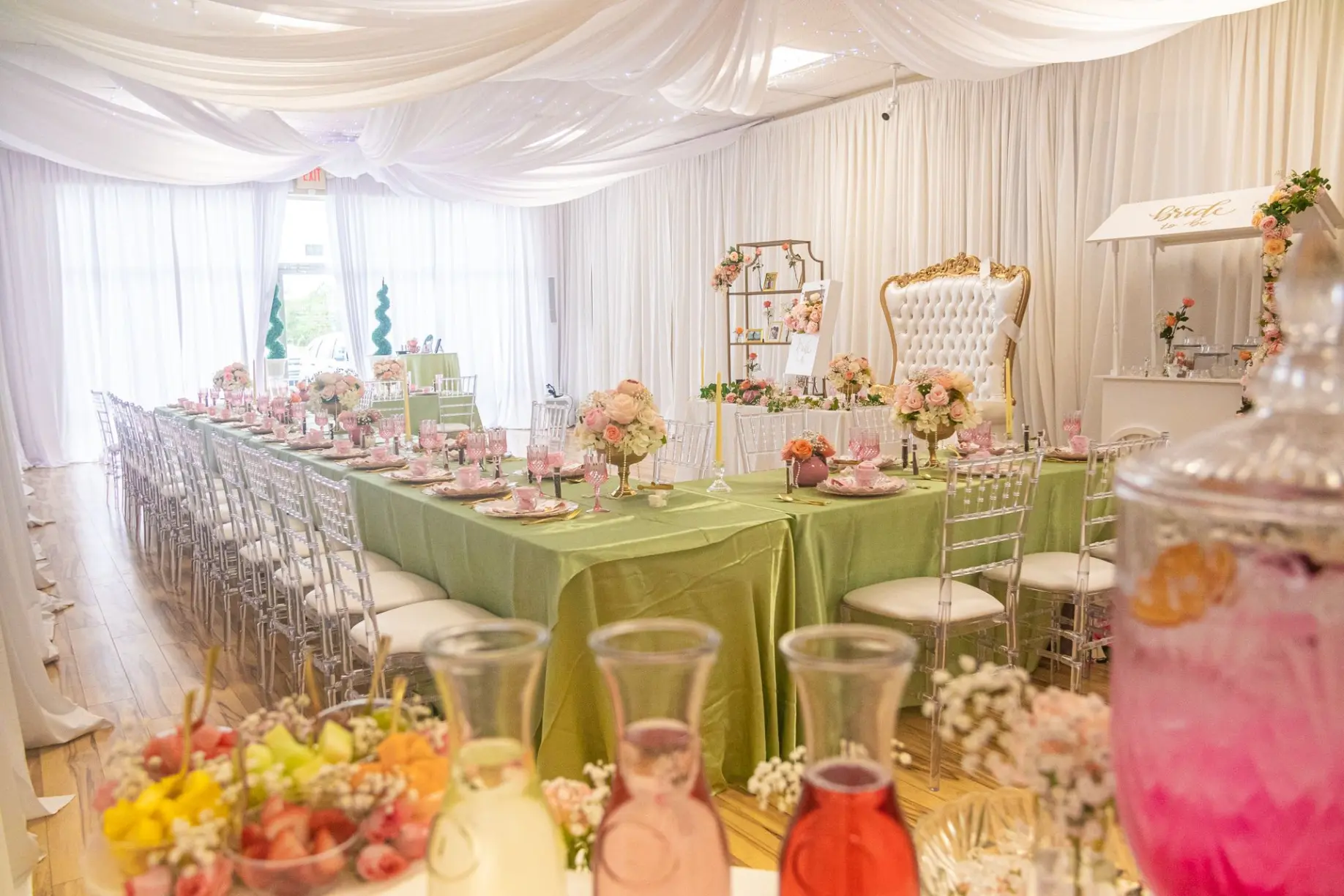 Soft pastel design featuring backdrop, gift table, and themed signage.