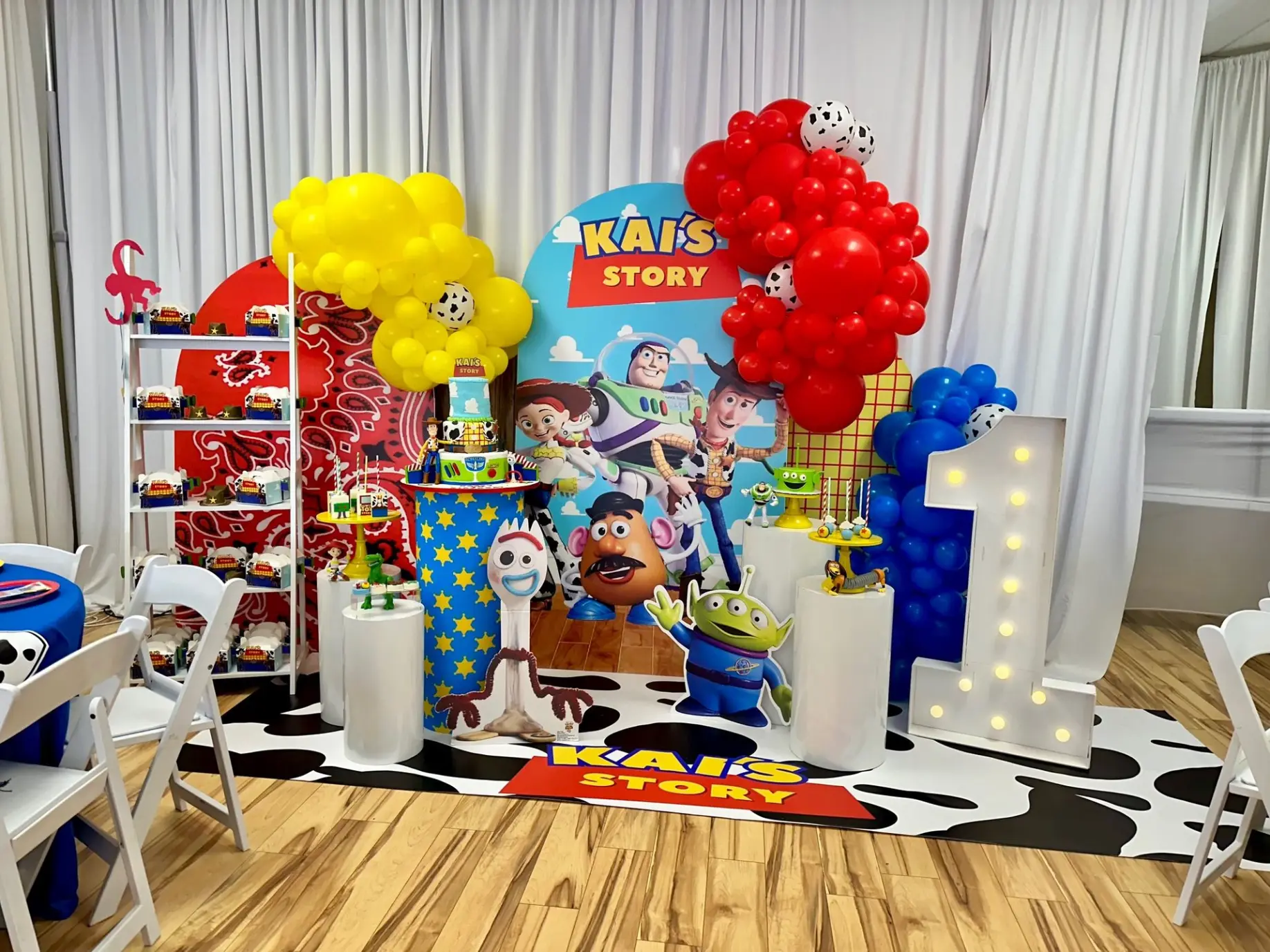Vibrant kids’ birthday with colorful balloon wall and Toy Story cartoon theme.