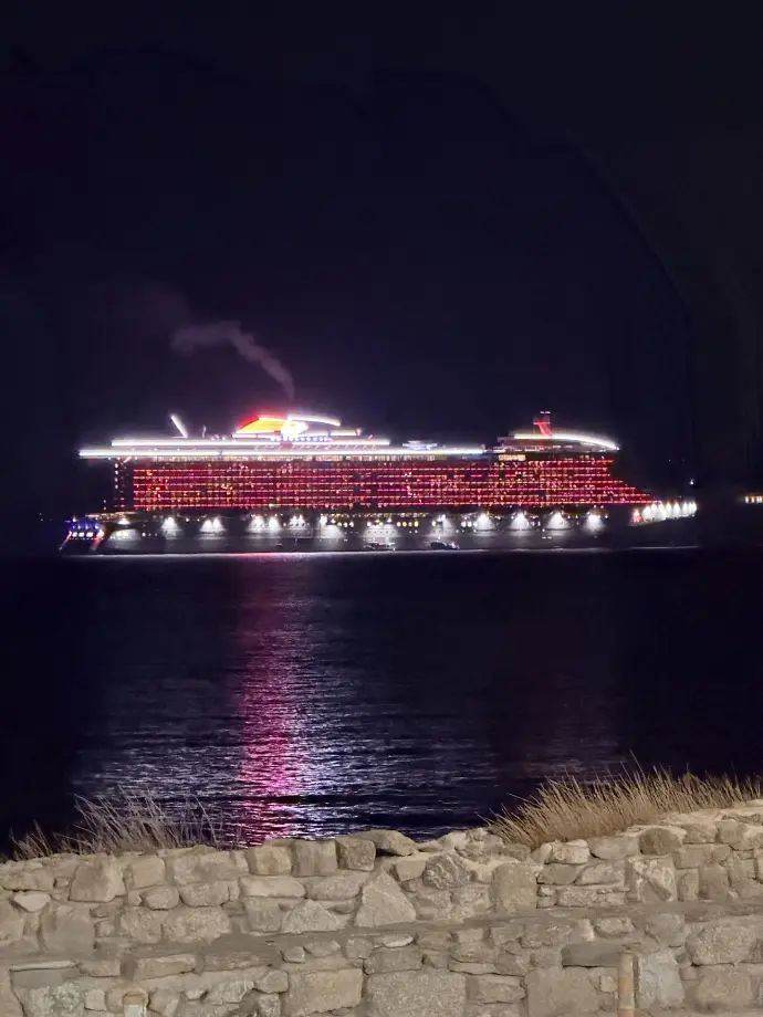 Beautiful view of the Virgin Voyage Resilient  Lady Cruise  Ship from the Island of Mykonos, Greece